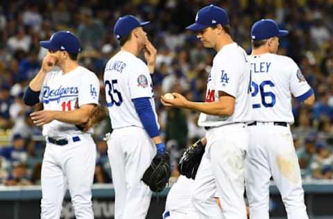 LOS ANGELES, CA – APRIL 14: Logan Forsythe #11, Cody Bellinger #35, Corey Seager #5 and Chase Utley #26 wait with starting pitcher Rich Hill #44 of the Los Angeles Dodgers for a review of a call on a three-run home run by Deven Marrero #10 of the Arizona Diamondbacks in the fourth inning of the game at Dodger Stadium on April 14, 2018 in Los Angeles, California. (Photo by Jayne Kamin-Oncea/Getty Images)