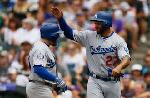 DENVER, CO – JUNE 3: Max Muncy #13 is congratulated by Matt Kemp #27 of the Los Angeles Dodgers after hitting a three-run home run during the third inning against the Colorado Rockies at Coors Field on June 3, 2018, in Denver, Colorado. (Photo by Justin Edmonds/Getty Images)