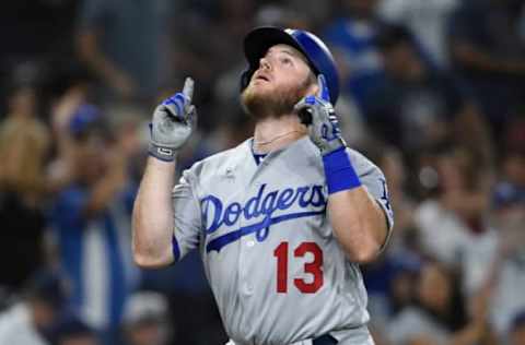 SAN DIEGO, CA – JULY 10: Max Muncy #13 of the Los Angeles Dodgers points skyward after hitting a solo home run during the ninth inning of a baseball game against the San Diego Padres at PETCO Park on July 10, 2018 in San Diego, California. (Photo by Denis Poroy/Getty Images)