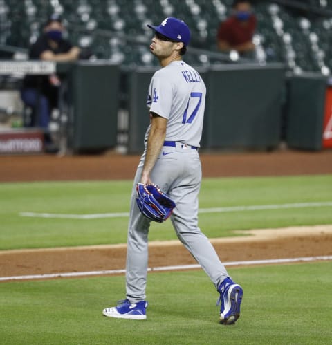 HOUSTON, TEXAS – JULY 28: Joe Kelly #17 of the Los Angeles Dodgers looks back at Carlos Correa #1 of the Houston Astros in the sixth inning as they exchange words after he knocked down Correa with a high pitch at Minute Maid Park on July 28, 2020 in Houston, Texas. (Photo by Bob Levey/Getty Images)