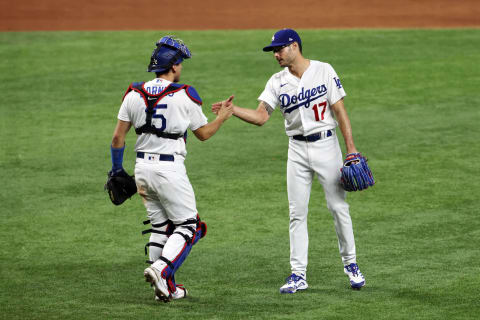 ARLINGTON, TEXAS – OCTOBER 07: Joe Kelly #17 of the Los Angeles Dodgers celebrates with Austin Barnes #15 after defeating the San Diego Padres 6-5 in Game Two of the National League Division Series at Globe Life Field on October 07, 2020 in Arlington, Texas. (Photo by Tom Pennington/Getty Images)