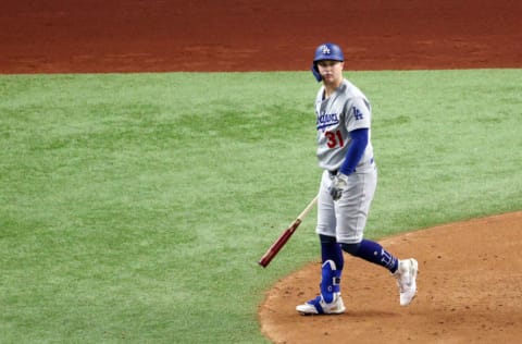 ARLINGTON, TEXAS - OCTOBER 25: Joc Pederson #31 of the Los Angeles Dodgers watches his solo home run leave the park against the Tampa Bay Rays during the second inning in Game Five of the 2020 MLB World Series at Globe Life Field on October 25, 2020 in Arlington, Texas. (Photo by Sean M. Haffey/Getty Images)