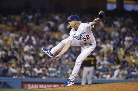 LOS ANGELES, CALIFORNIA - AUGUST 17: Phil Bickford #52 of the Los Angeles Dodgers pitches against the Pittsburgh Pirates during the seventh inning at Dodger Stadium on August 17, 2021 in Los Angeles, California. (Photo by Michael Owens/Getty Images)