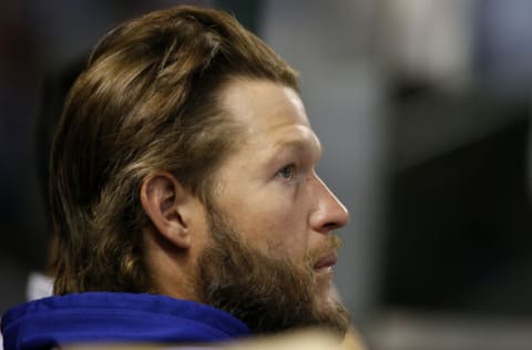 PHOENIX, ARIZONA - SEPTEMBER 24: Clayton Kershaw #22 of the Los Angeles Dodgers looks on from the dugout during the sixth inning of the MLB game against the Arizona Diamondbacks at Chase Field on September 24, 2021 in Phoenix, Arizona. (Photo by Ralph Freso/Getty Images)