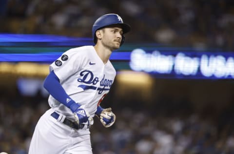 LOS ANGELES, CALIFORNIA - OCTOBER 02: Trea Turner #6 of the Los Angeles Dodgers runs to first base against the Milwaukee Brewers during the fifth inning at Dodger Stadium on October 02, 2021 in Los Angeles, California. (Photo by Michael Owens/Getty Images)