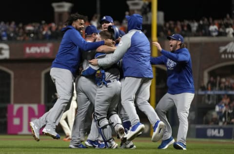 SAN FRANCISCO, CALIFORNIA - OCTOBER 14: The Los Angeles Dodgers celebrate after beating the San Francisco Giants 2-1 in game 5 of the National League Division Series at Oracle Park on October 14, 2021 in San Francisco, California. (Photo by Thearon W. Henderson/Getty Images)