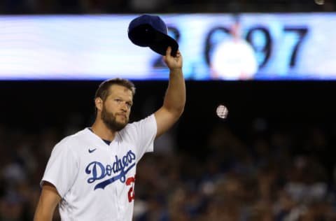 LOS ANGELES, CALIFORNIA - APRIL 30: Clayton Kershaw #22 of the Los Angeles Dodgers raises his hat to acknowledge the crowd after becoming the Los Angeles Dodgers All-Time Strikeout Leader during the fourth inning against the Detroit Tigers at Dodger Stadium on April 30, 2022 in Los Angeles, California. (Photo by Katelyn Mulcahy/Getty Images)