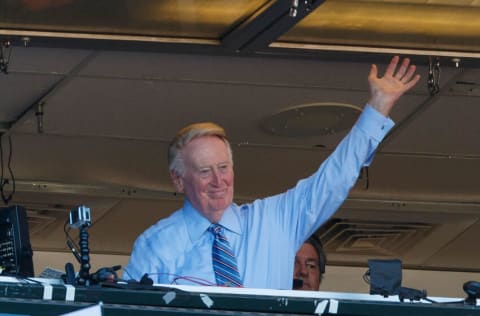 SAN FRANCISCO, CA - OCTOBER 02: Broadcaster Vin Scully waves to the crowd during the seventh inning between the San Francisco Giants and the Los Angeles Dodgers at AT&T Park on October 2, 2016 in San Francisco, California. The San Francisco Giants defeated the Los Angeles Dodgers 7-1. (Photo by Jason O. Watson/Getty Images)