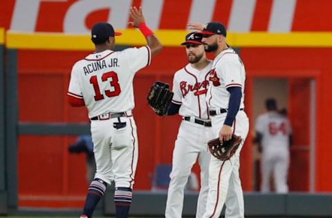 ATLANTA, GA – AUGUST 28: Ronald Acuna Jr. #13, Ender Inciarte #11 and Nick Markakis #22 of the Atlanta Braves react after their 9-5 win over the Tampa Bay Rays at SunTrust Park on August 28, 2018 in Atlanta, Georgia. (Photo by Kevin C. Cox/Getty Images)