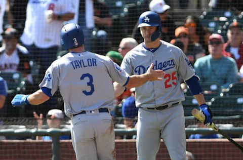 SAN FRANCISCO, CA – SEPTEMBER 30: Chris Taylor #3 of the Los Angeles Dodgers celebrates with David Freese #25 after scoring against the San Francisco Giants during their MLB game at AT&T Park on September 30, 2018 in San Francisco, California. (Photo by Robert Reiners/Getty Images)