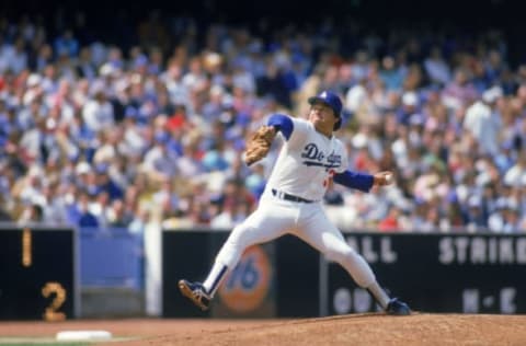 LOS ANGELES – 1985: Pitcher Fernando Valenzuela #34 of the Los Angeles Dodgers winds up for a pitch during a 1985 MLB season game at Dodger Stadium in Los Angeles, California. (Photo by: Rick Stewart/Getty Images)