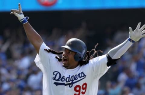 LOS ANGELES, CA – APRIL 18: Manny Ramirez #99 of the Los Angeles Dodgers celebrates after hitting a two-run homerun in the eighth inning against the San Francisco Giants at Dodger Stadium on April 18, 2010 in Los Angeles, California. The Dodgers defeated the Giants 2-1. (Photo by Jeff Gross/Getty Images)