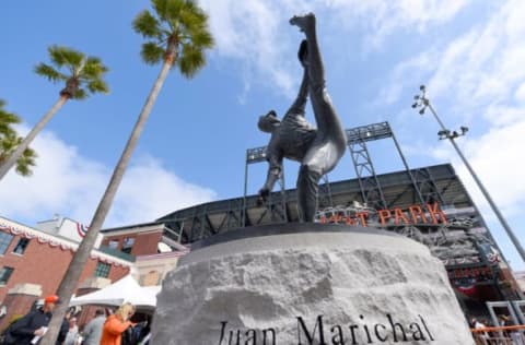 SAN FRANCISCO, CA – APRIL 13: Fans entering the ball park walk a statue former San Francisco Giants pitcher and MLB Hall of Famer Juan Marichal prior to the start of the game between the Colorado Rockies and San Francisco Giants on Opening Day at AT&T Park on April 13, 2015 in San Francisco, California. (Photo by Thearon W. Henderson/Getty Images)