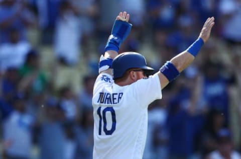 LOS ANGELES, CALIFORNIA – MARCH 31: Justin Turner #10 of the Los Angeles Dodgers celebrates scoring after A.J. Pollock #11 hits a two-run double against the Arizona Diamondbacks during the eighth inning at Dodger Stadium on March 31, 2019 in Los Angeles, California. (Photo by Yong Teck Lim/Getty Images)