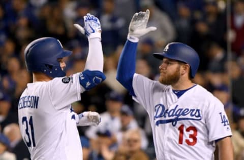 LOS ANGELES, CALIFORNIA – APRIL 16: Joc Pederson #31 of the Los Angeles Dodgers celebrates his two run homerun with Max Muncy #13 to take a 3-0 lead over the Cincinnati Reds during the second inning at Dodger Stadium on April 16, 2019 in Los Angeles, California. (Photo by Harry How/Getty Images)