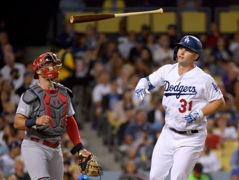 LOS ANGELES, CALIFORNIA – AUGUST 06: Joc Pederson #31 of the Los Angeles Dodgers reacts to his pop fly in front of Andrew Knizner #7 of the St. Louis Cardinals during the fifth inning at Dodger Stadium on August 06, 2019 in Los Angeles, California. (Photo by Harry How/Getty Images)