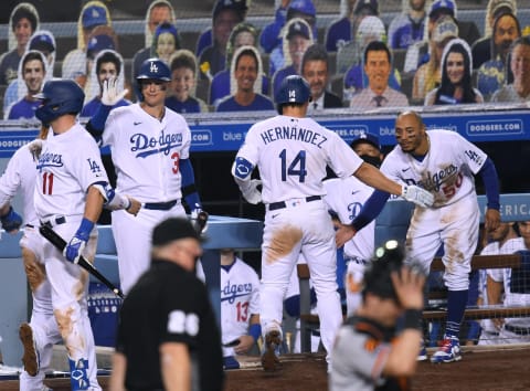 LOS ANGELES, CALIFORNIA – JULY 23: Mookie Betts #50 of the Los Angeles Dodgers celebrates a two run homerun from Enrique Hernandez #14 along with Joc Pederson #31, to take an 8-1 lead over the San Francisco Giants. (Photo by Harry How/Getty Images)