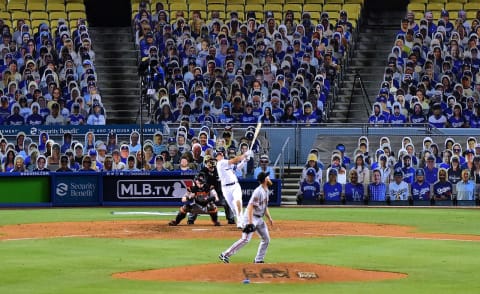 LOS ANGELES, CALIFORNIA – JULY 23: Enrique Hernandez #14 of the Los Angeles Dodgers hits a two run homerun off of Conner Menez #51 of the San Francisco Giants, to take an 8-1 lead during the eighth inning, on MLB Opening Day at Dodger Stadium on July 23, 2020 in Los Angeles, California. The 2020 season had been postponed since March due to the COVID-19 Pandemic. (Photo by Harry How/Getty Images)