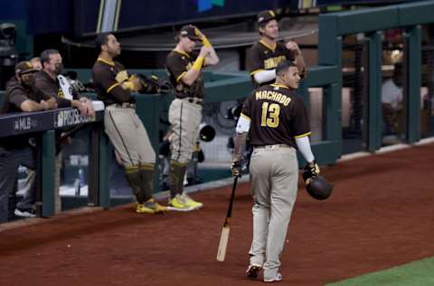 ARLINGTON, TEXAS - OCTOBER 07: Manny Machado #13 of the San Diego Padres yells at Max Muncy #13 of the Los Angeles Dodgers in the bottom of the seventh inning at Globe Life Field on October 07, 2020 in Arlington, Texas. (Photo by Tom Pennington/Getty Images)