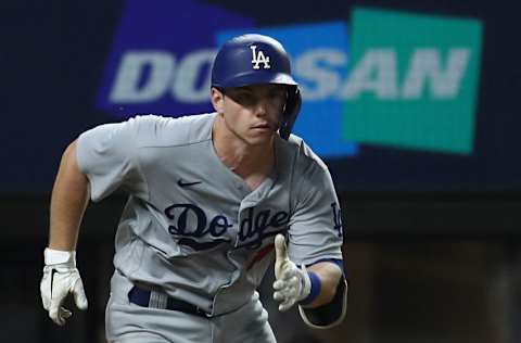 ARLINGTON, TEXAS - OCTOBER 08: Will Smith #16 of the Los Angeles Dodgers hits a two-run RBI double during the ninth inning against Trevor Rosenthal #47 of the San Diego Padres in Game Three of the National League Division Series at Globe Life Field on October 08, 2020 in Arlington, Texas. Will Smith #16 of the Los Angeles Dodgers became the first player in Dodgers history to have five hits during the postseason. (Photo by Ronald Martinez/Getty Images)