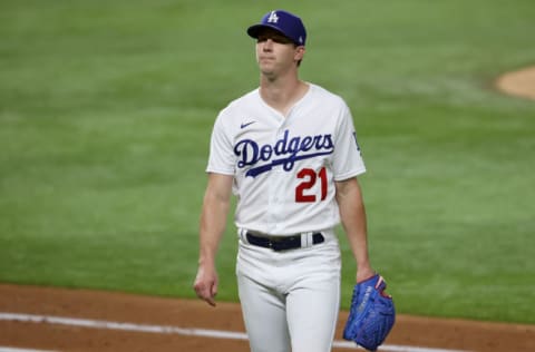 ARLINGTON, TEXAS - OCTOBER 12: Walker Buehler
#21 of the Los Angeles Dodgers leaves the game against the Atlanta Braves during the sixth inning in Game One of the National League Championship Series at Globe Life Field on October 12, 2020 in Arlington, Texas. (Photo by Tom Pennington/Getty Images)