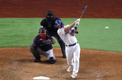 ARLINGTON, TEXAS - OCTOBER 13: Will Smith #16 of the Los Angeles Dodgers hits a single against the Atlanta Braves during the sixth inning in Game Two of the National League Championship Series at Globe Life Field on October 13, 2020 in Arlington, Texas. (Photo by Ron Jenkins/Getty Images)