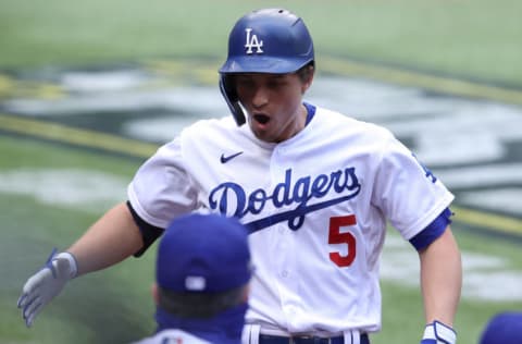 ARLINGTON, TEXAS - OCTOBER 17: Corey Seager #5 of the Los Angeles Dodgers celebrates after hitting a solo home run against the Atlanta Braves during the first inning in Game Six of the National League Championship Series at Globe Life Field on October 17, 2020 in Arlington, Texas. (Photo by Tom Pennington/Getty Images)