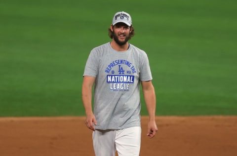 ARLINGTON, TEXAS - OCTOBER 18: Clayton Kershaw #22 of the Los Angeles Dodgers celebrates the teams 4-3 victory against the Atlanta Braves in Game Seven of the National League Championship Series at Globe Life Field on October 18, 2020 in Arlington, Texas. (Photo by Ronald Martinez/Getty Images)