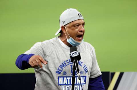 ARLINGTON, TEXAS - OCTOBER 18: Manager Dave Roberts of the Los Angeles Dodgers celebrates with his team following their 4-3 victory against the Atlanta Braves in Game Seven of the National League Championship Series at Globe Life Field on October 18, 2020 in Arlington, Texas. (Photo by Tom Pennington/Getty Images)