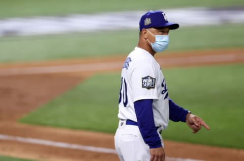 ARLINGTON, TEXAS - OCTOBER 20: Manager Dave Roberts of the Los Angeles Dodgers makes a pitching change against the Tampa Bay Rays during the seventh inning in Game One of the 2020 MLB World Series at Globe Life Field on October 20, 2020 in Arlington, Texas. (Photo by Tom Pennington/Getty Images)