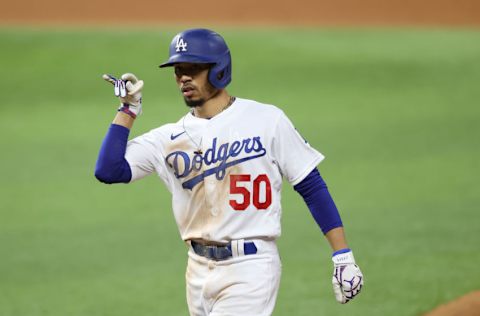 ARLINGTON, TEXAS - OCTOBER 20: Mookie Betts #50 of the Los Angeles Dodgers hits a single against the Tampa Bay Rays during the eighth inning in Game One of the 2020 MLB World Series at Globe Life Field on October 20, 2020 in Arlington, Texas. (Photo by Tom Pennington/Getty Images)