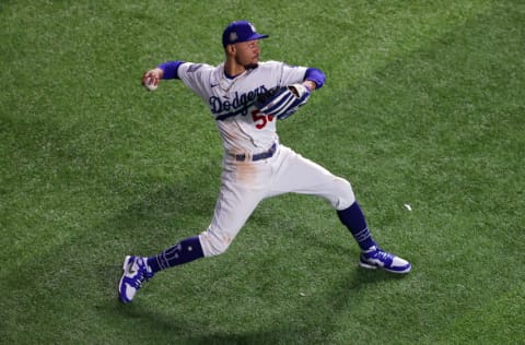 ARLINGTON, TEXAS - OCTOBER 21: Mookie Betts #50 of the Los Angeles Dodgers fields a hit against the Tampa Bay Rays during the seventh inning in Game Two of the 2020 MLB World Series at Globe Life Field on October 21, 2020 in Arlington, Texas. (Photo by Ronald Martinez/Getty Images)