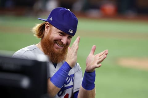 ARLINGTON, TEXAS - OCTOBER 23: Justin Turner #10 of the Los Angeles Dodgers celebrates the teams 6-2 victory against the Tampa Bay Rays in Game Three of the 2020 MLB World Series at Globe Life Field on October 23, 2020 in Arlington, Texas. (Photo by Rob Carr/Getty Images)