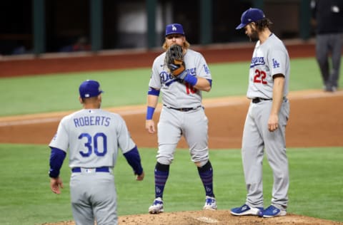 ARLINGTON, TEXAS - OCTOBER 25: Clayton Kershaw #22 of the Los Angeles Dodgers is taken out of the game by manager Dave Roberts as Justin Turner #10 looks on during the sixth inning against the Tampa Bay Rays in Game Five of the 2020 MLB World Series at Globe Life Field on October 25, 2020 in Arlington, Texas. (Photo by Tom Pennington/Getty Images)