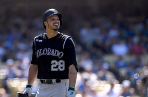 LOS ANGELES, CALIFORNIA - JUNE 23: Nolan Arenado #28 of the Colorado Rockies reacts as he walks back to the dugout after his strikeout at Dodger Stadium on June 23, 2019 in Los Angeles, California. (Photo by Harry How/Getty Images)