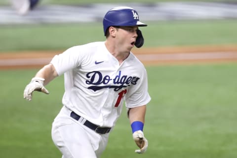 ARLINGTON, TEXAS – OCTOBER 18: Will Smith #16 of the Los Angeles Dodgers celebrates a two-RBI single against the Atlanta Braves during the third inning in Game Seven of the National League Championship Series at Globe Life Field on October 18, 2020 in Arlington, Texas. (Photo by Tom Pennington/Getty Images)