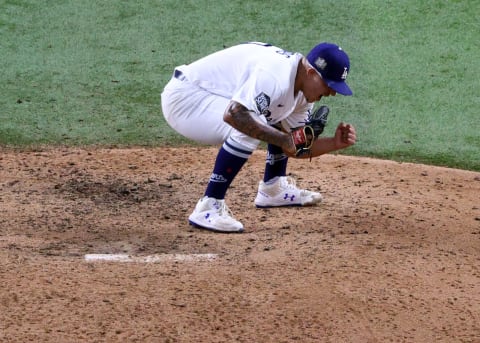 ARLINGTON, TEXAS – OCTOBER 27: Julio Urias #7 of the Los Angeles Dodgers celebrates after defeating the Tampa Bay Rays 3-1 in Game Six to win the 2020 MLB World Series at Globe Life Field on October 27, 2020 in Arlington, Texas. (Photo by Sean M. Haffey/Getty Images)