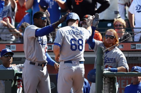 SAN FRANCISCO, CA - APRIL 27: Yasiel Puig #66 and Justin Turner #10 congratulate Ross Stripling #68 of the Los Angeles Dodgers after he scored in the 10th inning against the San Francisco Giants at AT&T Park on April 27, 2017 in San Francisco, California. (Photo by Ezra Shaw/Getty Images)