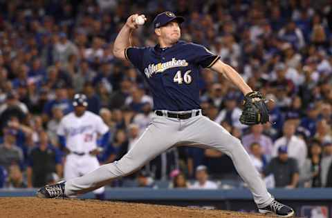 LOS ANGELES, CA - OCTOBER 16: Corey Knebel #46 of the Milwaukee Brewers delivers a pitch in the ninth inning against the Los Angeles Dodgers in Game Four of the National League Championship Series at Dodger Stadium on October 16, 2018 in Los Angeles, California. (Photo by Harry How/Getty Images)