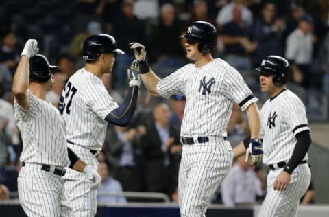 NEW YORK, NEW YORK - SEPTEMBER 19: (NEW YORK DAILIES OUT) DJ LeMahieu #26 of the New York Yankees celebrates against the Los Angeles Angels of Anaheim with teammates Brett Gardner #11 (L), Giancarlo Stanton #27 and Austin Romine #28 (R) at Yankee Stadium on September 19, 2019 in New York City. The Yankees defeated the Angels 9-1 to clinch the American League East division. (Photo by Jim McIsaac/Getty Images)