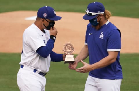 LOS ANGELES, CA - SEPTEMBER 13: Manager Dave Roberts of the Los Angeles Dodgers presents the Roberto Clemente Award to Justin Turner #10 before playing the Houston Astros at Dodger Stadium on September 13, 2020 in Los Angeles, California. (Photo by John McCoy/Getty Images)