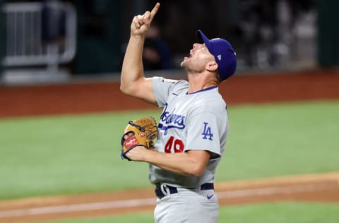 ARLINGTON, TEXAS - OCTOBER 25: Blake Treinen #49 of the Los Angeles Dodgers celebrates after striking out Willy Adames (not pictured) of the Tampa Bay Rays to secure the 4-2 victory in Game Five of the 2020 MLB World Series at Globe Life Field on October 25, 2020 in Arlington, Texas. (Photo by Tom Pennington/Getty Images)