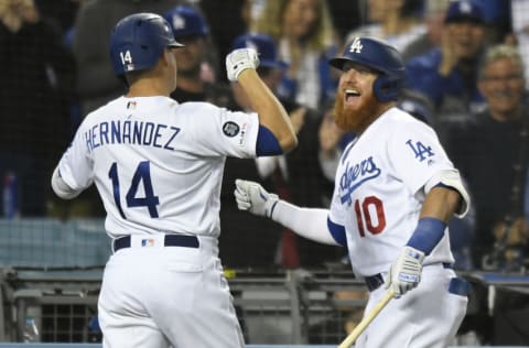 LOS ANGELES, CA - JUNE 18: Justin Turner #10 congratulates Enrique Hernandez #14 of the Los Angeles Dodgers on his grand slam home run against the San Francisco Giants in the seventh inning at Dodger Stadium on June 18, 2019 in Los Angeles, California. (Photo by John McCoy/Getty Images)