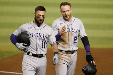 PHOENIX, ARIZONA - SEPTEMBER 26: Trevor Story #27 of the Colorado Rockies talks with Kevin Pillar #11 of the Rockies as they walk of the field following the seventh inning of the MLB game against the Arizona Diamondbacks at Chase Field on September 26, 2020 in Phoenix, Arizona. (Photo by Ralph Freso/Getty Images)