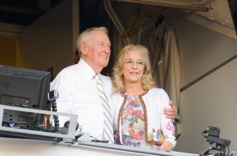 LOS ANGELES, CA - SEPTEMBER 25: Los Angeles Dodgers announcer Vin Scully and his wife Sandra Hunt hug together after a 4-3 win over the Colorado Rockies at Dodger Stadium on September 25, 2016 in Los Angeles, California. (Photo by Noel M Vasquez/Getty Images)