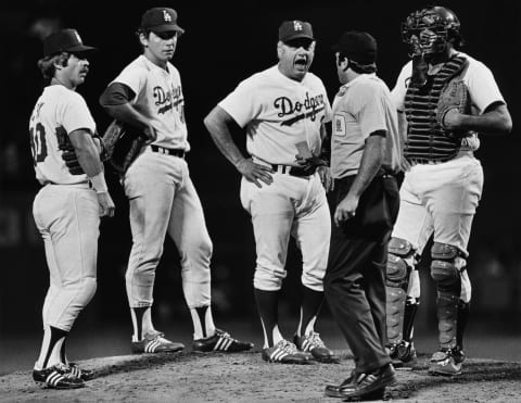 CENTURY CITY, CA – 1980: Los Angeles Dodgers Hall of Fame coach, Tommy Lasorda (center), argues with a National League umpire during a 1980 Los Angeles, California, baseball game. (Photo by George Rose/Getty Images)