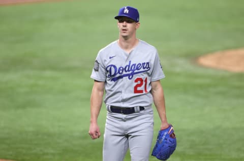 ARLINGTON, TEXAS - OCTOBER 23: Walker Buehler #21 of the Los Angeles Dodgers walks back to the dugout after retiring the side against the Tampa Bay Rays during the sixth inning in Game Three of the 2020 MLB World Series at Globe Life Field on October 23, 2020 in Arlington, Texas. (Photo by Sean M. Haffey/Getty Images)