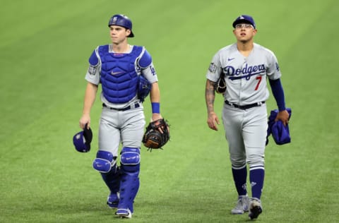 ARLINGTON, TEXAS - OCTOBER 24: Will Smith #16 and Julio Urias #7 of the Los Angeles Dodgers head to the dugout prior to Game Four of the 2020 MLB World Series against the Tampa Bay Rays at Globe Life Field on October 24, 2020 in Arlington, Texas. (Photo by Tom Pennington/Getty Images)