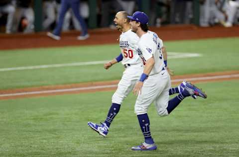 ARLINGTON, TEXAS - OCTOBER 27: Cody Bellinger #35 and Mookie Betts #50 of the Los Angeles Dodgers celebrate after defeating the Tampa Bay Rays 3-1 in Game Six to win the 2020 MLB World Series at Globe Life Field on October 27, 2020 in Arlington, Texas. (Photo by Tom Pennington/Getty Images)