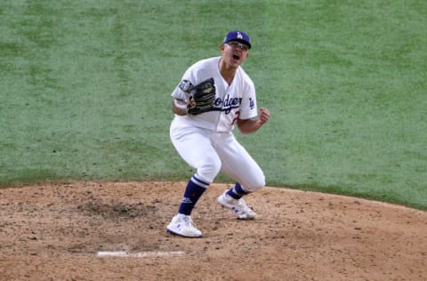 ARLINGTON, TEXAS - OCTOBER 27: Julio Urias #7 of the Los Angeles Dodgers celebrates after defeating the Tampa Bay Rays 3-1 in Game Six to win the 2020 MLB World Series at Globe Life Field on October 27, 2020 in Arlington, Texas. (Photo by Sean M. Haffey/Getty Images)